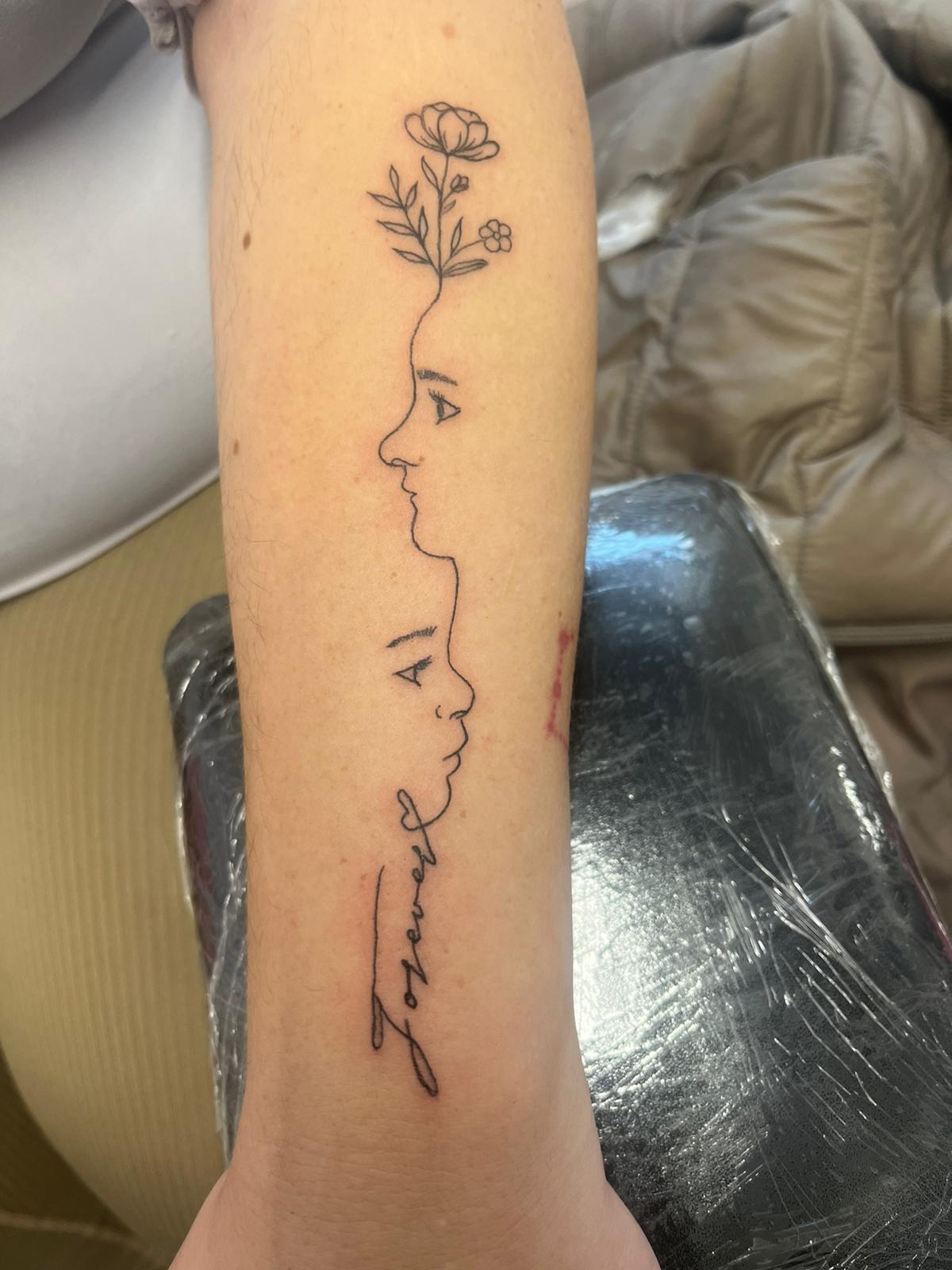 Minimalist script fine line tattoo by Ink By LOLO Southport